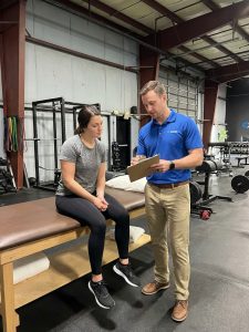  Patient working with a provider at a performance physical therapy clinic in Henrico