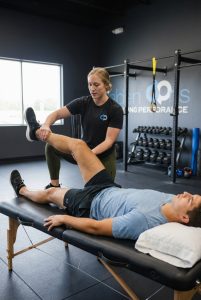 Patient working with a provider at a performance physical therapy clinic in Henrico